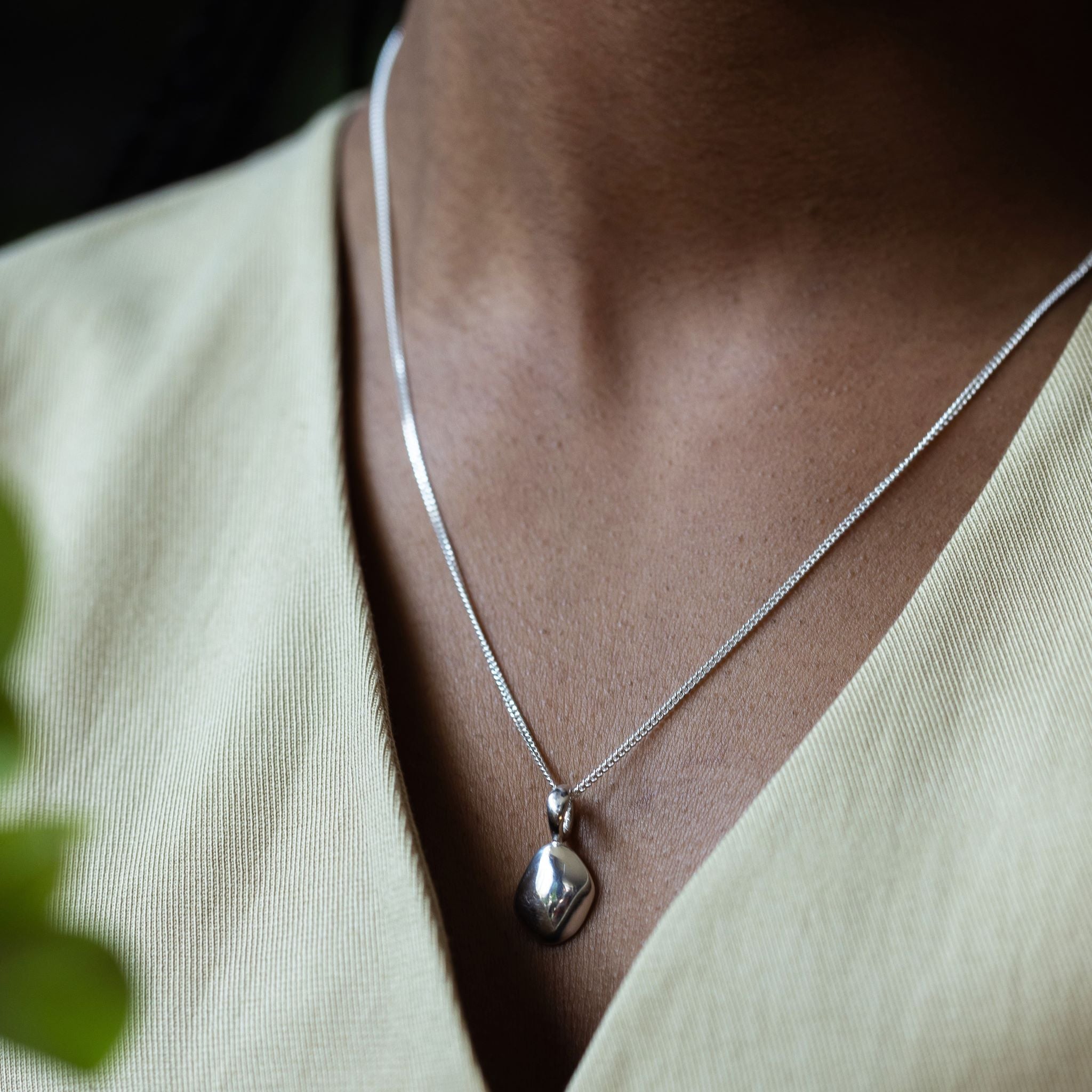 Pendant features a handcut natural pebble shape and is crafted from sterling silver or 18ct gold vermeil.