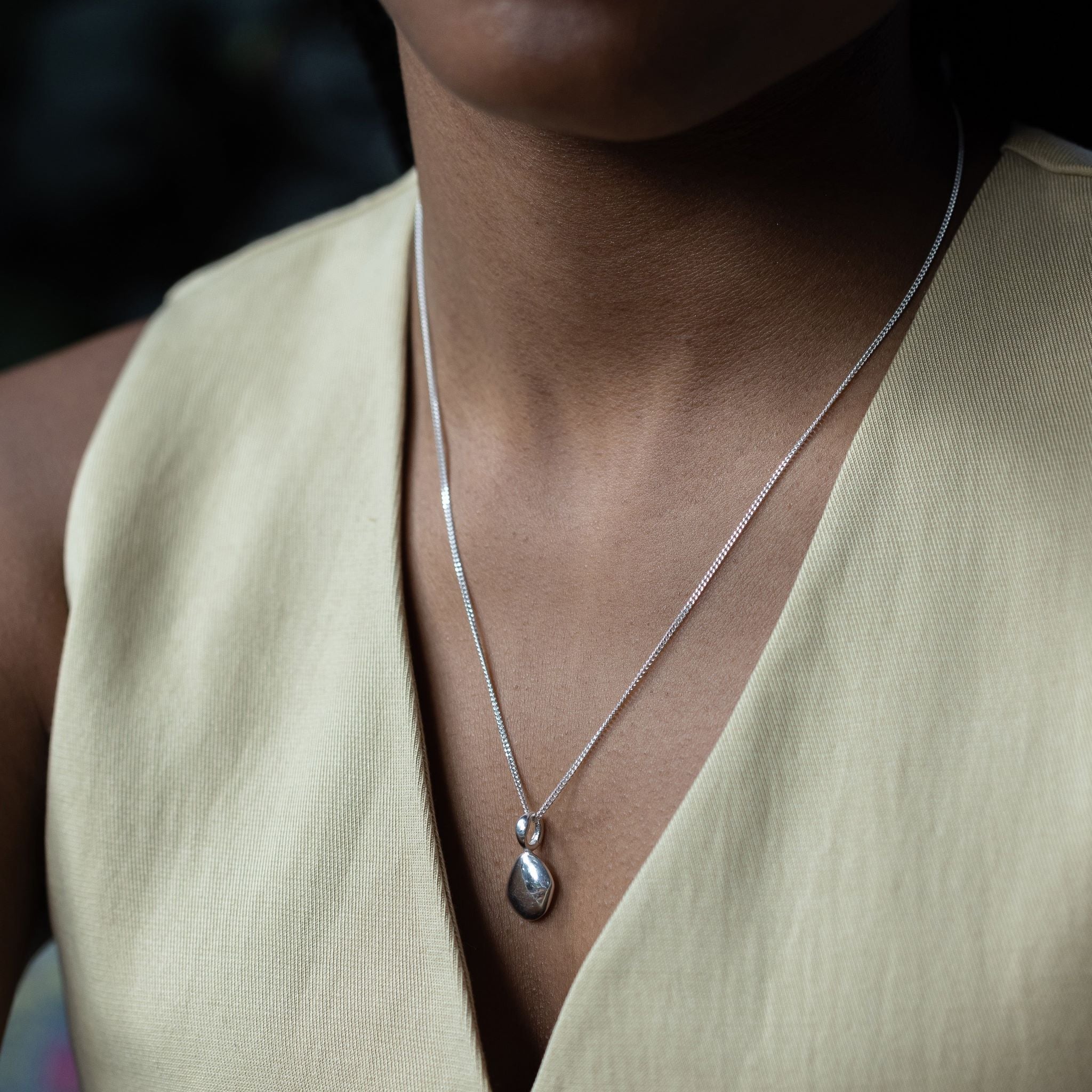 Pendant features a handcut natural pebble shape and is crafted from sterling silver or 18ct gold vermeil.