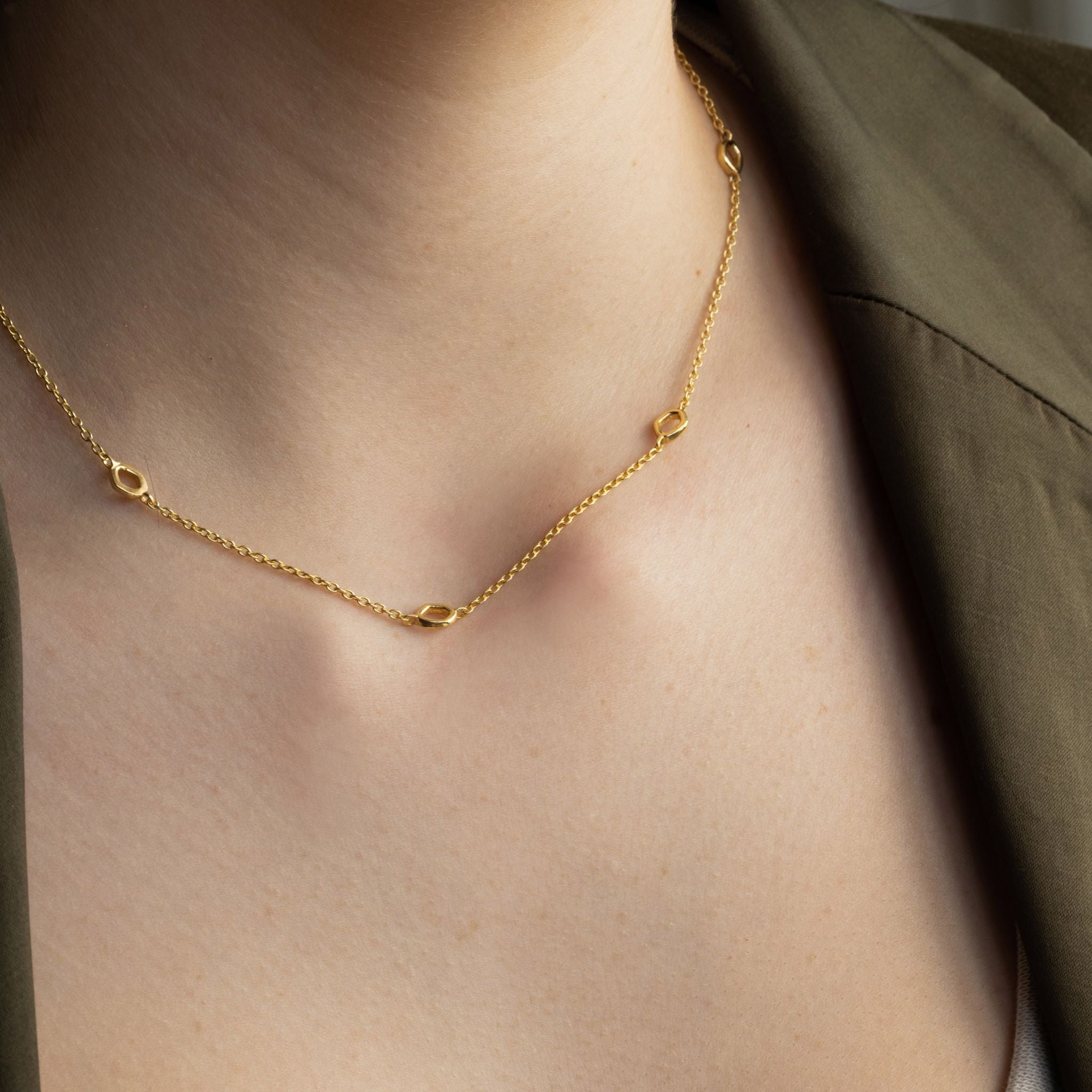 Dapple necklace is inspired by gentle evening sunlight filtering through the trees and are crafted in sterling silver and 18ct gold vermeil