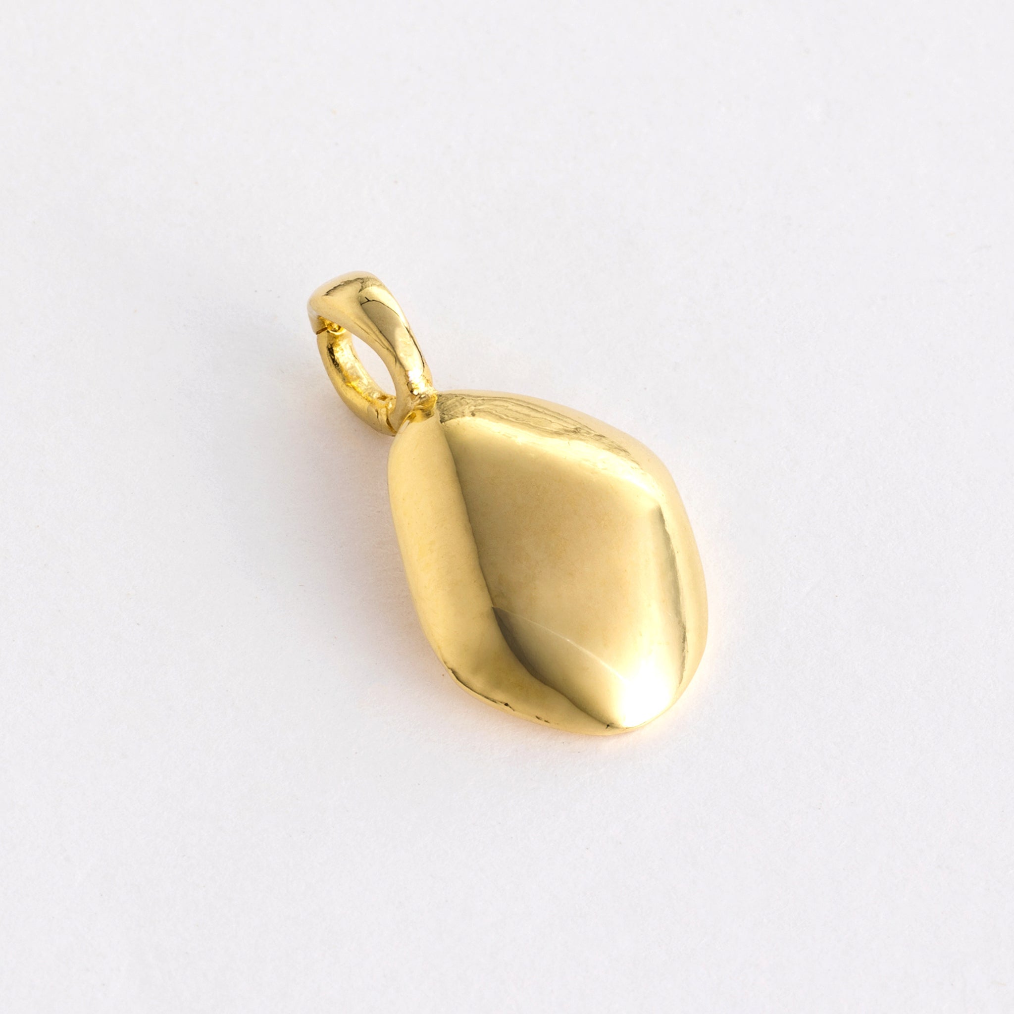 Charm features a handcut natural pebble shape and is crafted from sterling silver or 18ct gold vermeil.