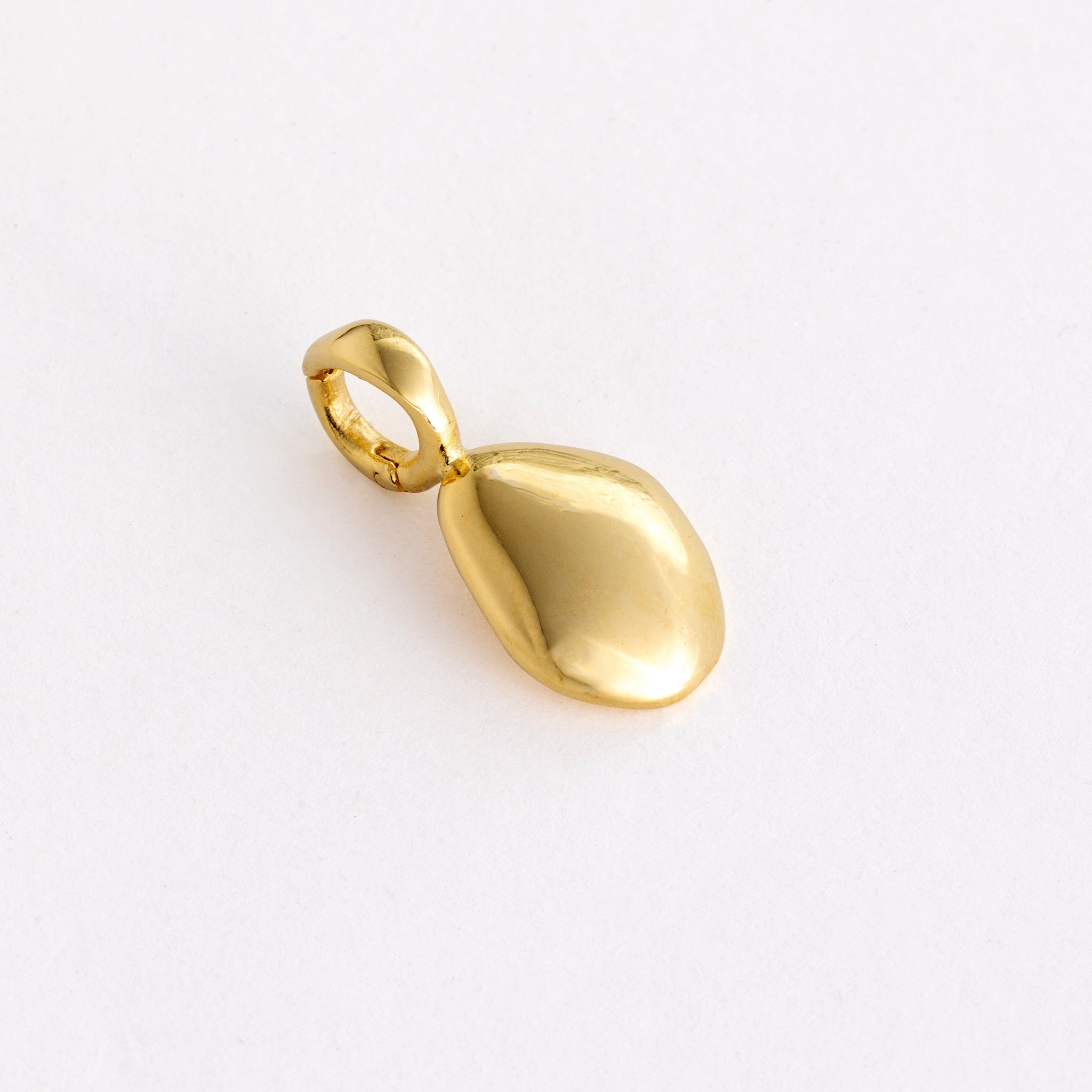 Charm features a handcut natural pebble shape and is crafted from sterling silver or 18ct gold vermeil.