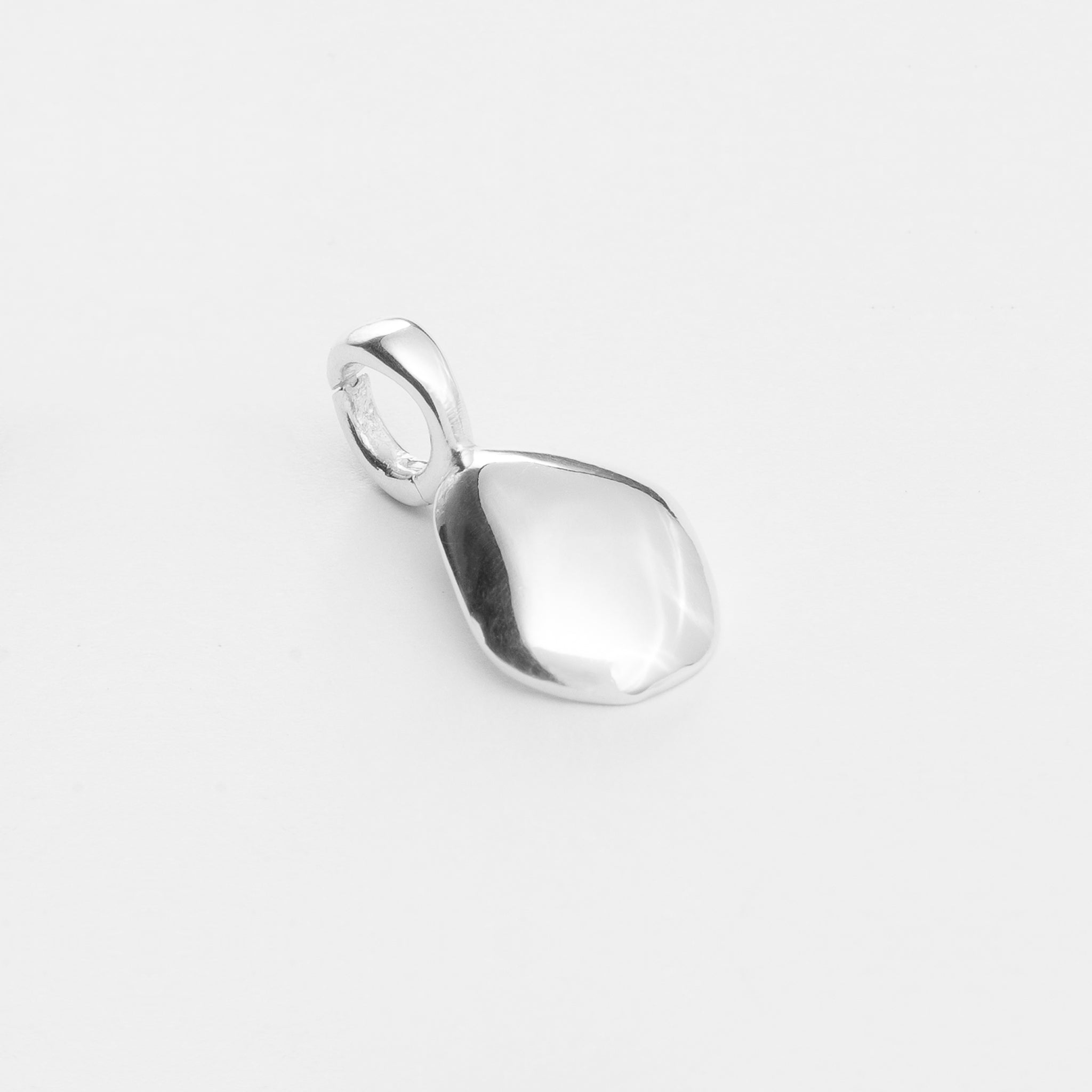 Charm features a handcut natural pebble shape and is crafted from sterling silver or 18ct gold vermeil.