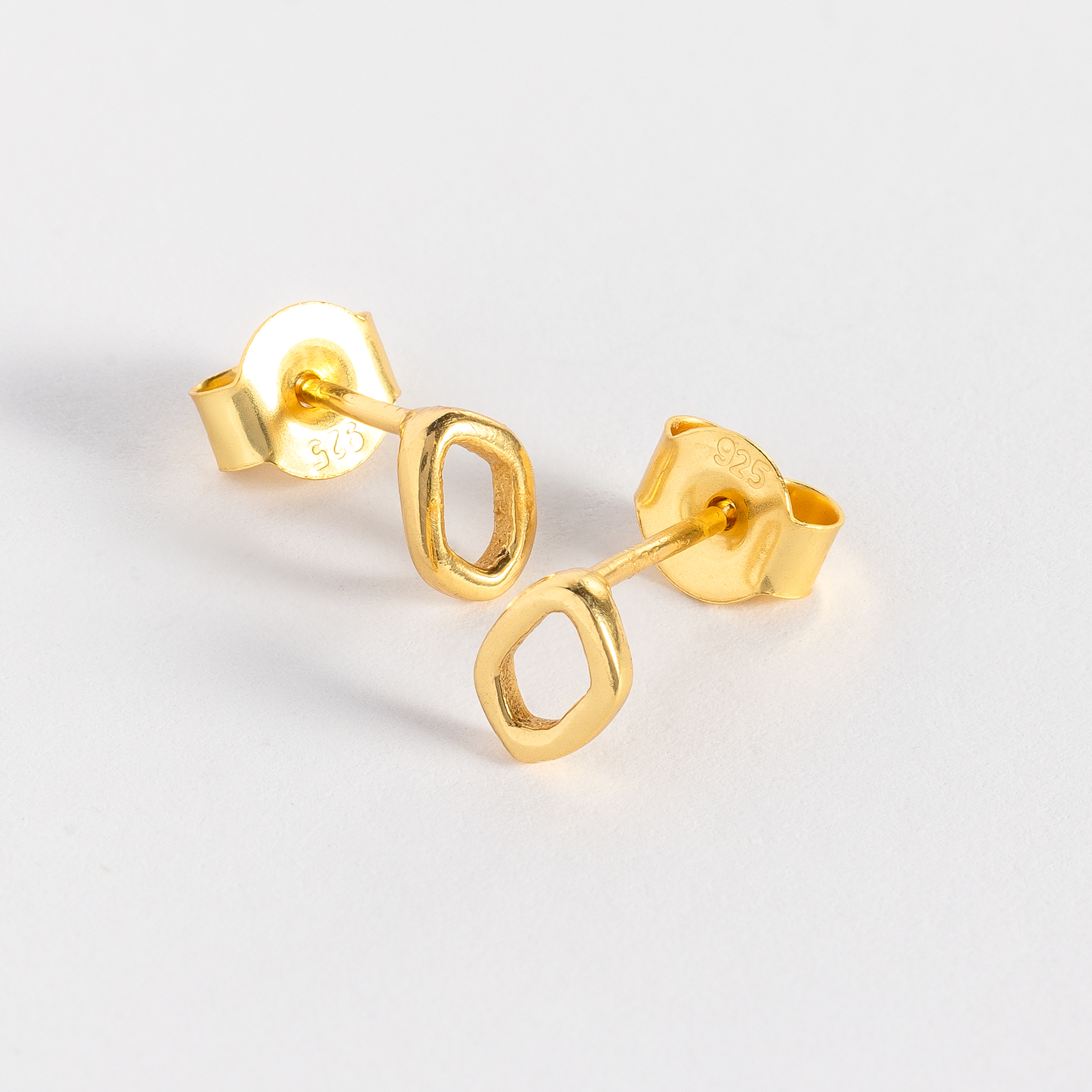 Dapple studs are inspired by gentle evening sunlight filtering through the trees and are crafted in sterling silver and 18ct gold vermeil